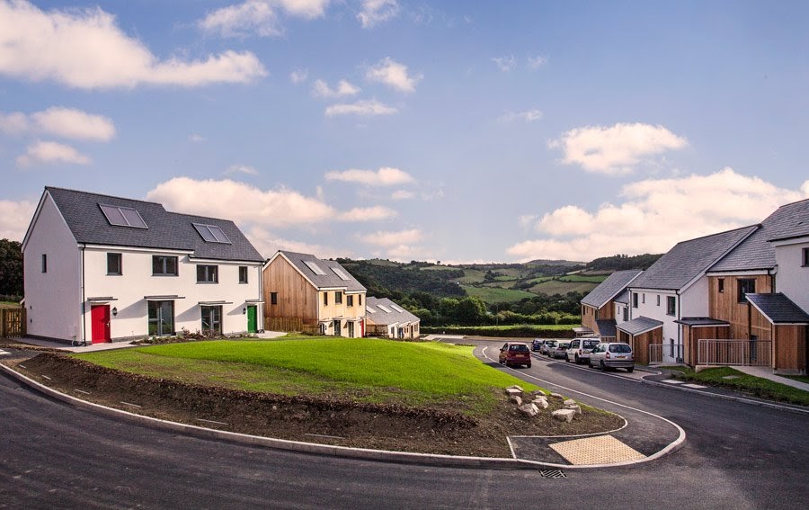 Several pairs of contemporary semi detached  houses on a curved street in Christow, Dartmoor