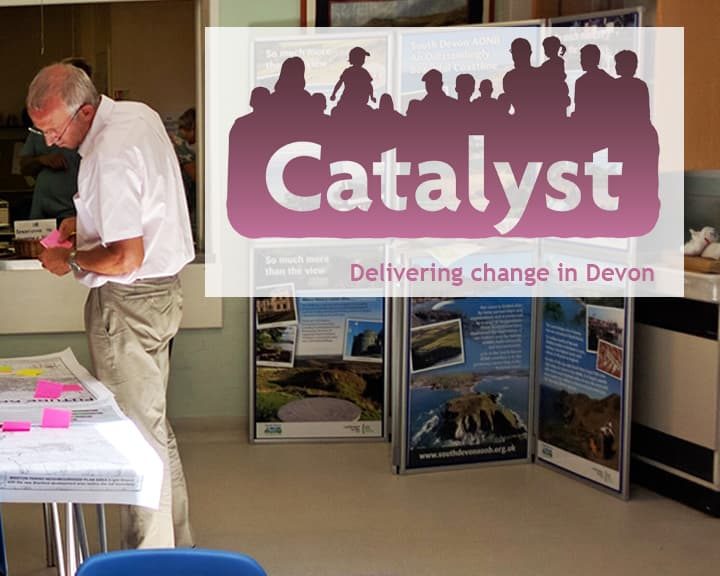 group of people at a community consultation event. Catalyst logo
