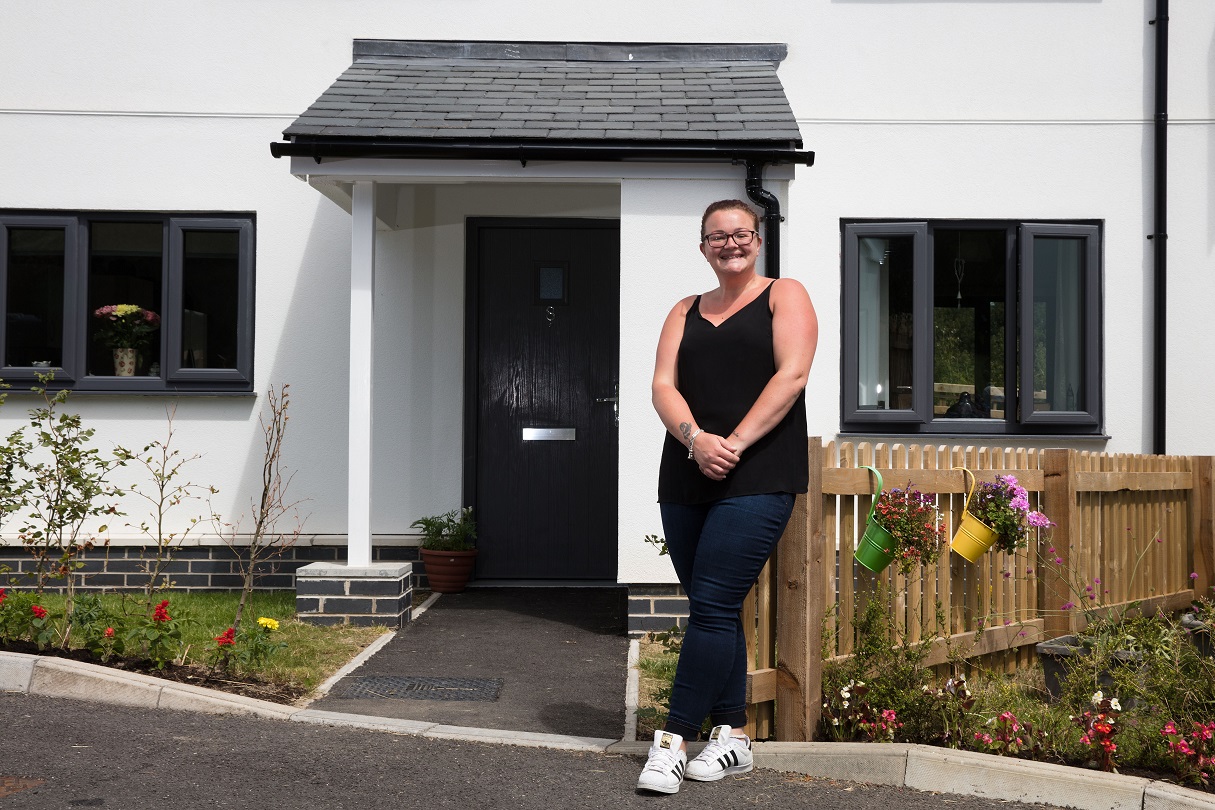 Person stood outside a new house front door